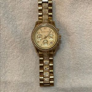 Michael Kors gold watch -missing some gems in band